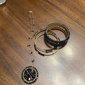 Set of hand made necklace with bracelets.
